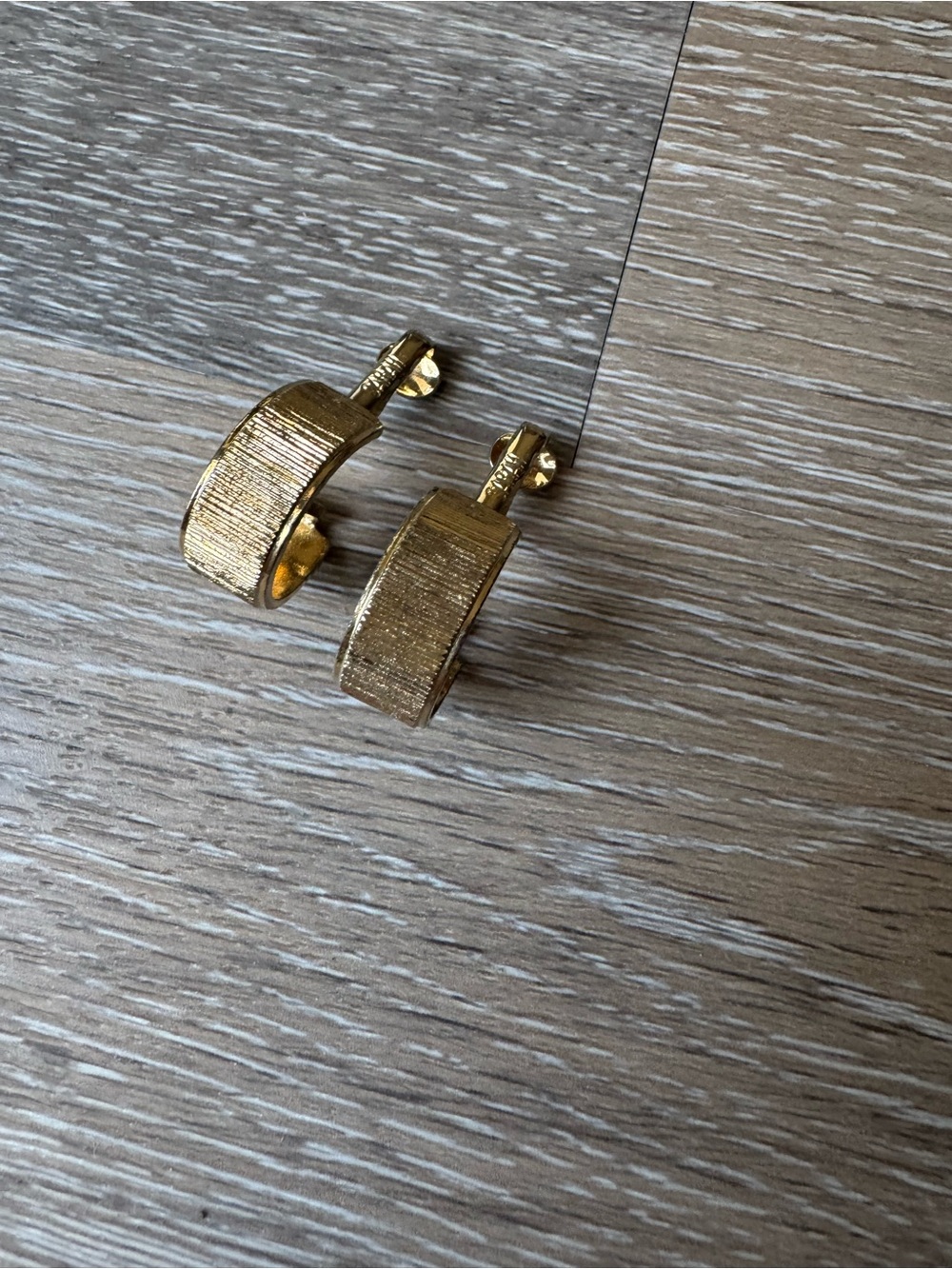 Sarah Coventry thick gold toned textured huggie clip on earrings